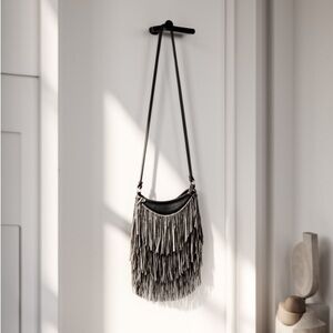 fringe shoulder bag by the brand I.N.C. International